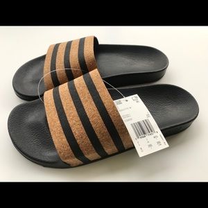Adidas Adilette cork slides sandals.